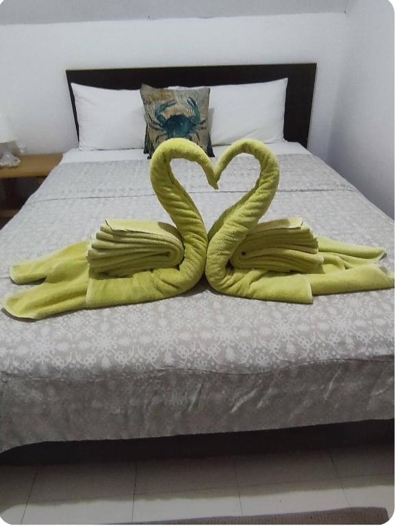 Bed prepared with folded towel decorations
