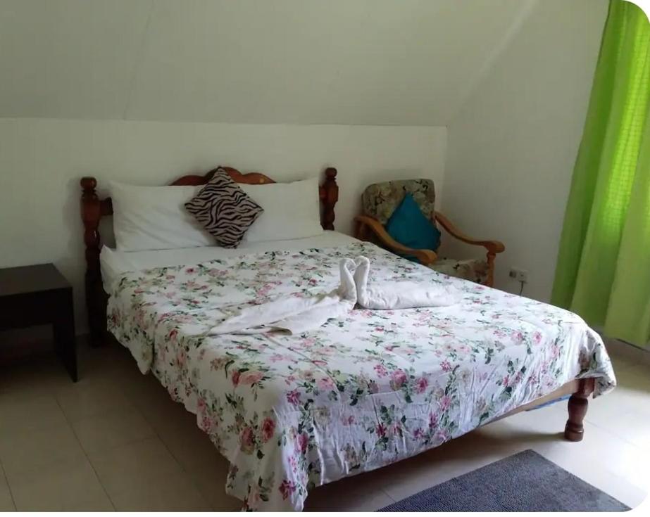 Ground-floor bedroom with floral bed linen