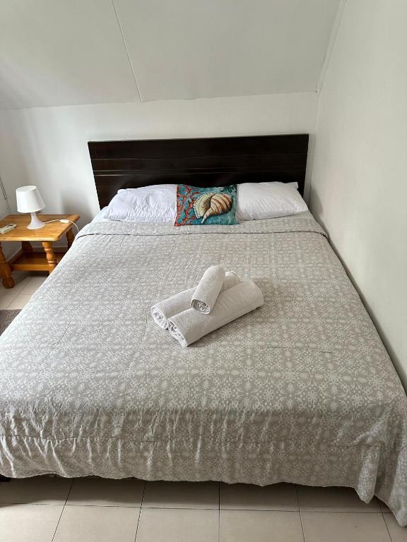 Ground-floor bedroom with neutral bed linen